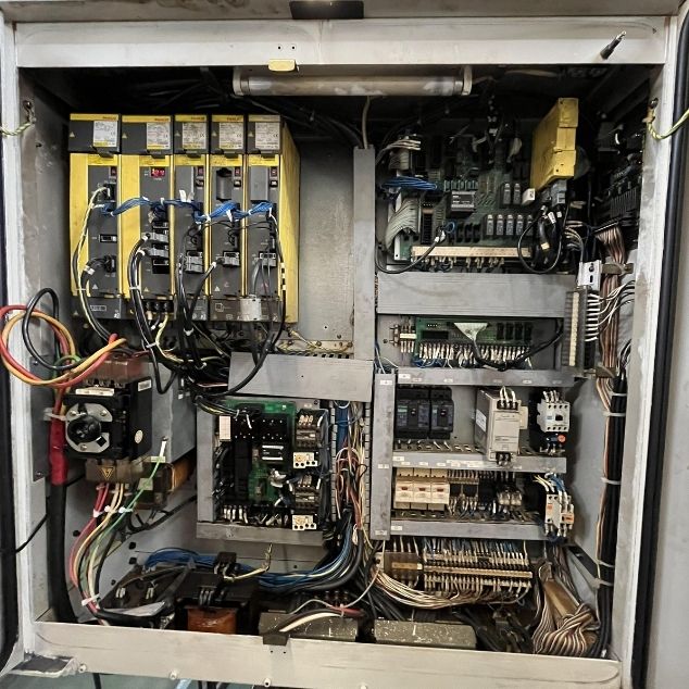 Restrukturisasi dan perbaikan wiring kompleks pada terminal block panel kontrol mesin otomotif tingkat lanjut.