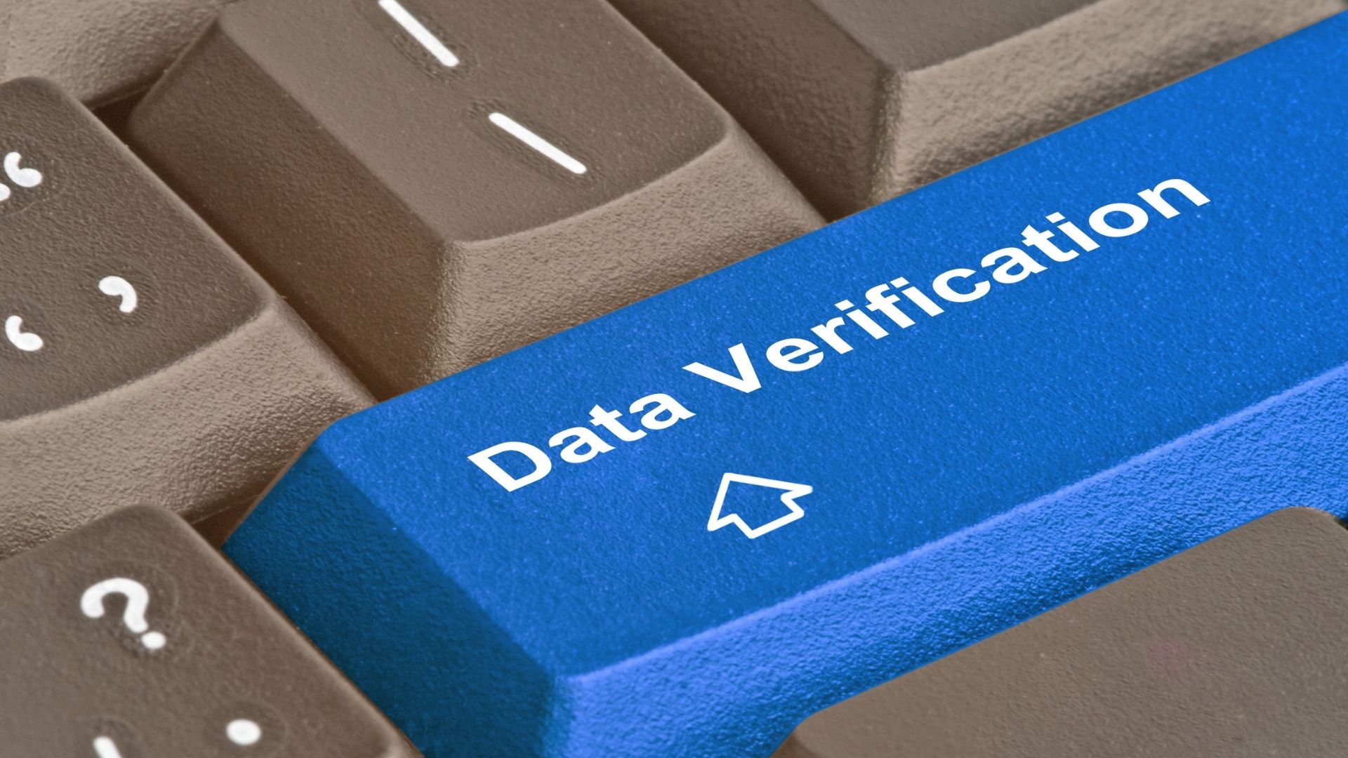 Ilustrasi tombol biru bertuliskan Data Verification pada keyboard yang merepresentasikan portal resmi pengecekan keaslian sertifikat kelulusan PT Industrial Control Indonesia